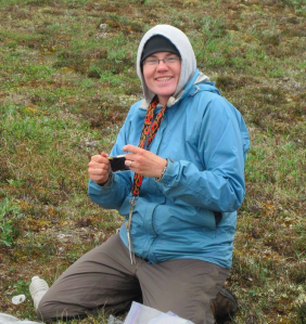 PhD student Crystal Ernst, happily working on the Arctic tundra.