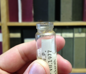 Trouble in the collection: A vial with a cracked glass lip.